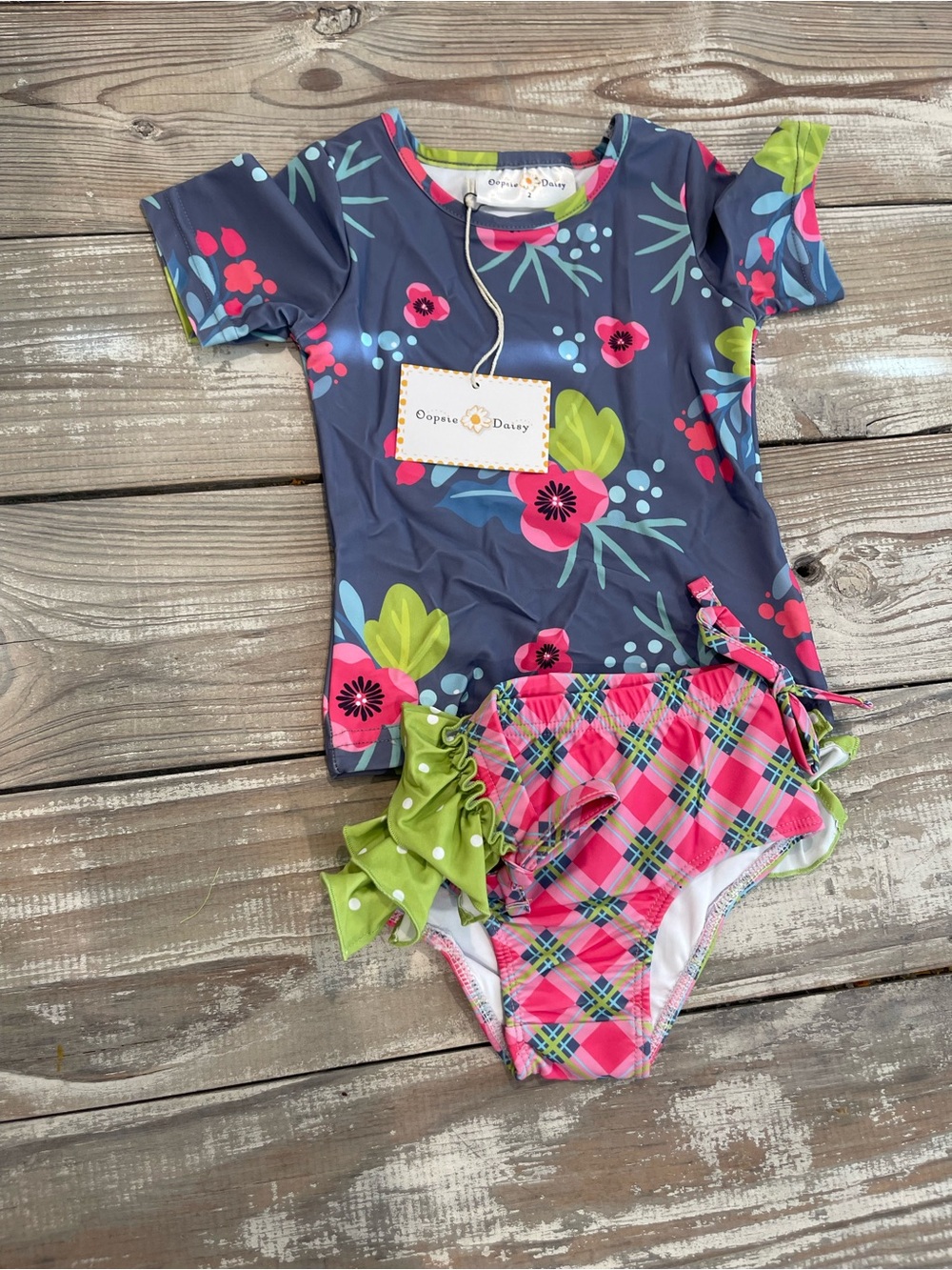 Ocean & Daisy Girls' Navy Floral Rash Guard with Pink Plaid Ruffle Bottoms